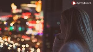 girl staring out into the night sky