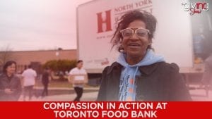 woman with glasses smiling