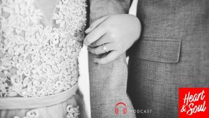 Engaged woman holding fiance's arm