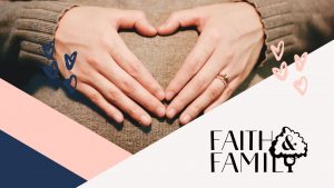 woman's hands on top of her pregnant bump