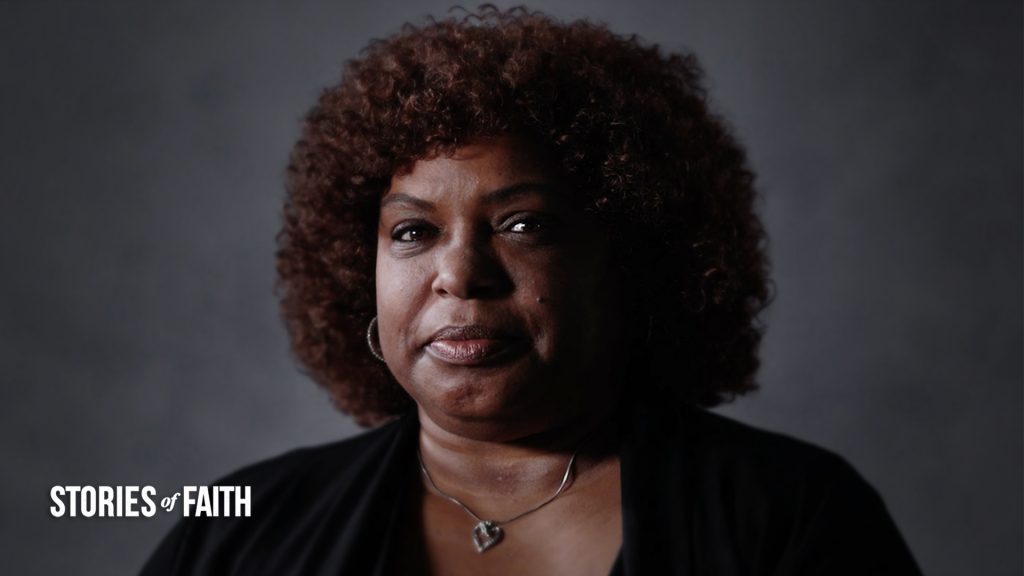 woman looking into camera with text stories of faith
