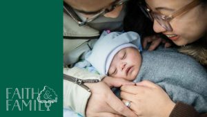 Parents with their child with Down's Syndrome