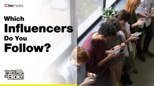 A group of individuals in a line, each of them with their faces down staring at their smart phones in their hands; text reads "Which Influencers Do You Follow?"