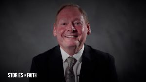 Man in suit smiling